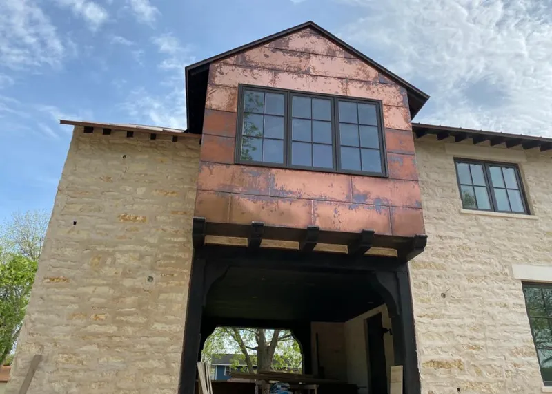 Copper metal panel facade on a stone building for Metal Roof Coating in Freeport